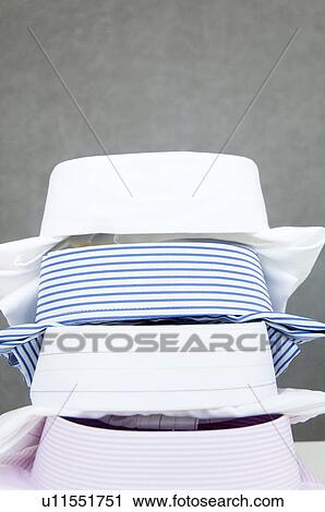 Folded shirts View Large Photo Image Stock Image - Folded shirts. Fotosearch