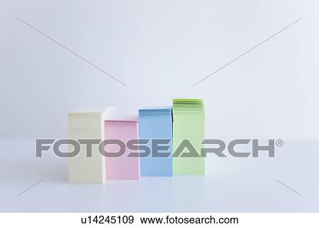 Stock Photo - Four stacks of colored adhesive notes. Fotosearch
