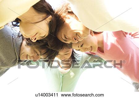 Friends in a huddle View Large Photo Image Stock Image - Friends in a huddle. Fotosearch