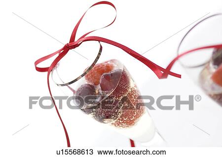 Stock Image - Fruit champagne cocktail. Fotosearch