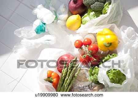 Fruit, vegetables and eggs with plastic shopping bags View Large Photo Image Stock Image - Fruit, vegetables and eggs with plastic shopping bags. Fotosearch