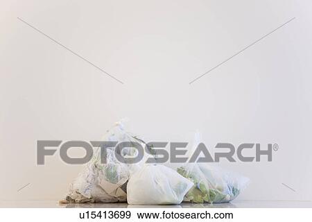 Garbage in plastic bags View Large Photo Image Stock Photo - Garbage in plastic bags. Fotosearch
