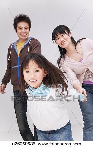 Girl pulling parents by the hands View Large Photo Image Stock Photograph - Girl pulling parents by the hands. Fotosearch
