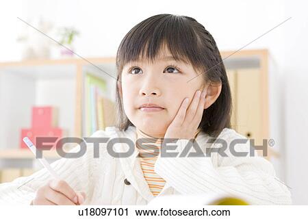 Stock Image - Girl studying. Fotosearch