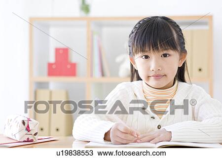 Stock Image - Girl studying. Fotosearch