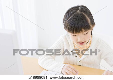 Girl using a computer View Large Photo Image Stock Image - Girl using a computer. Fotosearch