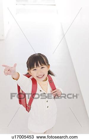 Girl wearing a backpack View Large Photo Image Stock Image - Girl wearing a backpack. Fotosearch
