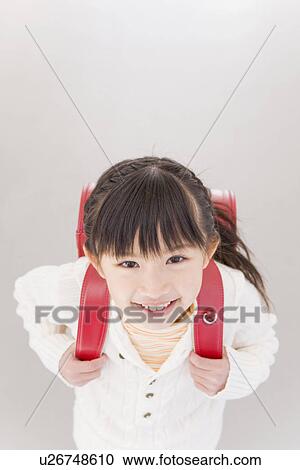 Girl wearing a backpack View Large Photo Image Stock Image - Girl wearing a backpack. Fotosearch