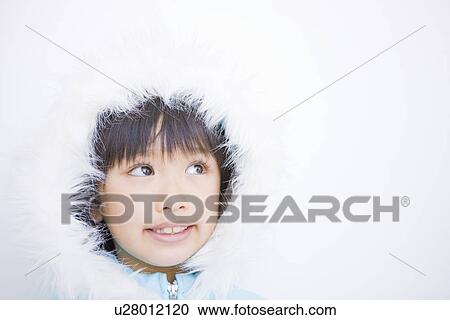 Stock Image - Girl wearing a hooded jacket. Fotosearch