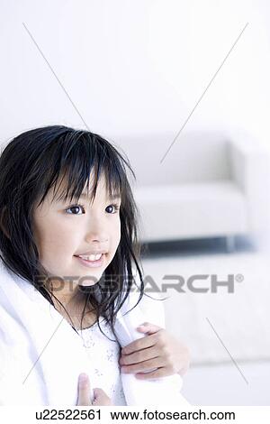Stock Image - Girl with a towel around her neck. Fotosearch