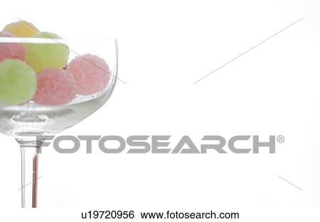 Glass of candy View Large Photo Image Stock Photograph - Glass of candy. Fotosearch