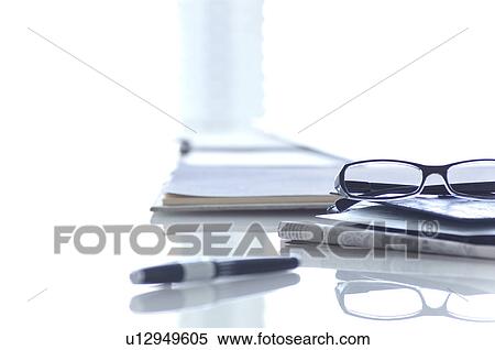 Stock Photography - Glasses, pen and newspaper. Fotosearch