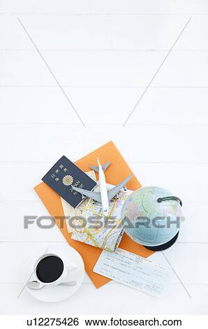 Stock Photograph - Globe, passport, and cup of coffee. Fotosearch