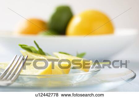 Stock Photo - Grapefruit slice on table setting. Fotosearch