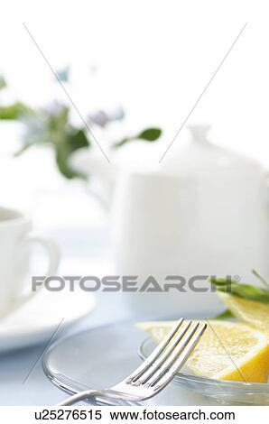 Stock Photography - Grapefruit slice on table setting. Fotosearch