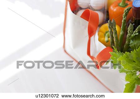 Stock Image - Groceries in an eco-bag. Fotosearch