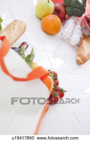 Stock Image - Groceries in an eco-bag. Fotosearch
