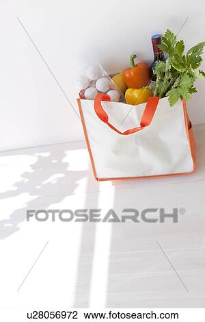Groceries in an eco-bag View Large Photo Image Stock Image - Groceries in an eco-bag. Fotosearch