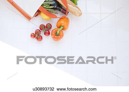 Groceries in an eco-bag View Large Photo Image Stock Image - Groceries in an eco-bag. Fotosearch