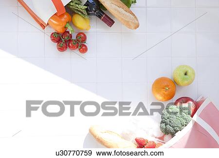 Groceries in an eco-bag View Large Photo Image Stock Photo - Groceries in an eco-bag. Fotosearch