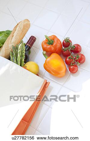 Stock Photograph - Groceries in an eco-bag. Fotosearch