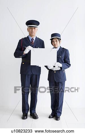 Guards holding a whiteboard View Large Photo Image Stock Image - Guards holding a whiteboard. Fotosearch