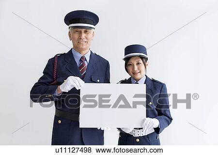 Guards holding a whiteboard View Large Photo Image Stock Photo - Guards holding a whiteboard. Fotosearch