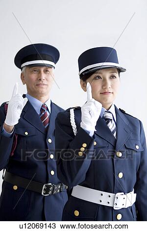 Stock Image - Guards raising fingers. Fotosearch