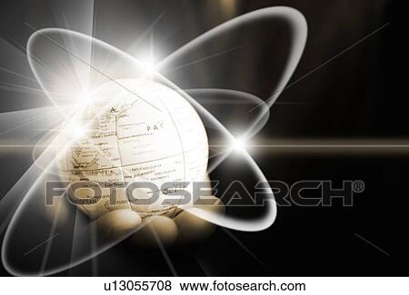 Stock Photo - Hand holding a globe orbited by light. Fotosearch