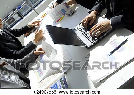 Hands of office workers planning in a meeting View Large Photo Image Stock Photograph - Hands of office workers planning in a meeting. Fotosearch