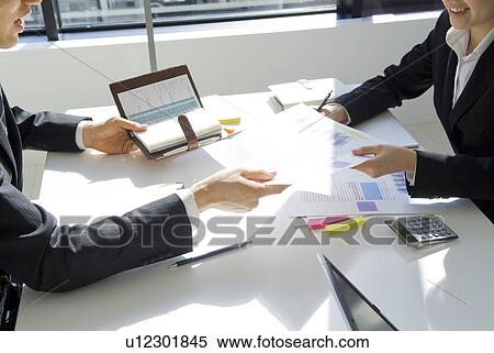 Hands of office workers planning in a meeting View Large Photo Image Stock Photography - Hands of office workers planning in a meeting. Fotosearch