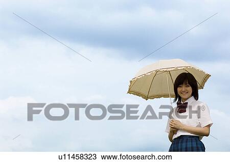 High school girl holding parasol View Large Photo Image Stock Image - High school girl holding parasol. Fotosearch