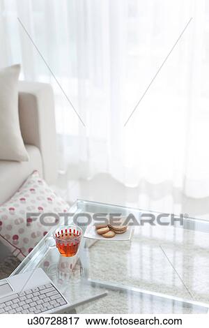 Ice tea, cookies and a laptop on a coffee table View Large Photo Image Stock Photo - Ice tea, cookies and a laptop on a coffee table. Fotosearch