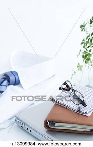 Picture - Laptop and business shirt. Fotosearch