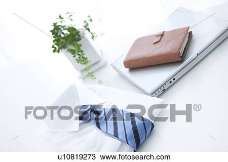 Stock Image - Laptop and business shirt. Fotosearch