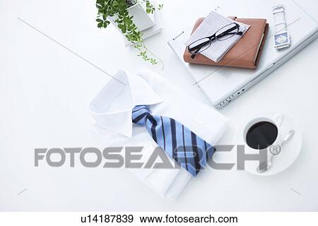 Laptop and business shirt View Large Photo Image Stock Photo - Laptop and business shirt. Fotosearch