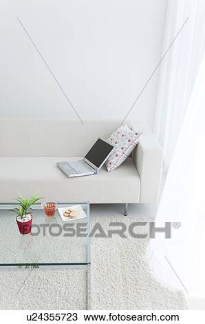 Laptop on a sofa and afternoon tea View Large Photo Image Stock Image - Laptop on a sofa and afternoon tea. Fotosearch