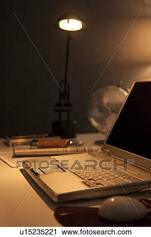 Laptop on desk in office View Large Photo Image Stock Image - Laptop on desk in office. Fotosearch
