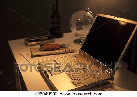 Stock Image - Laptop on desk in office. Fotosearch