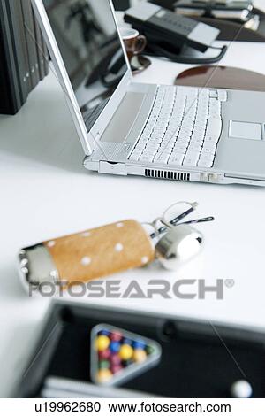Stock Image - Laptop on office desk. Fotosearch