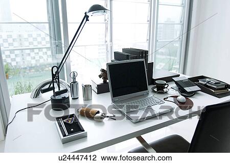 Stock Image - Laptop on office desk. Fotosearch