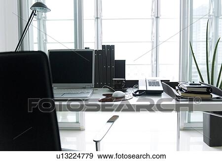 Stock Photo - Laptop on office desk. Fotosearch