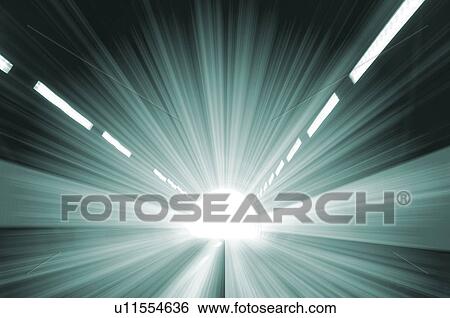 Stock Photograph - Light shining through a tunnel. Fotosearch