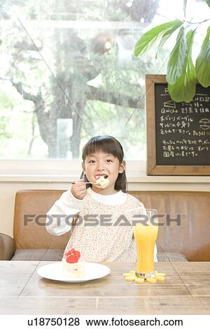 Little girl eating strawberry cake View Large Photo Image Stock Photo - Little girl eating strawberry cake. Fotosearch
