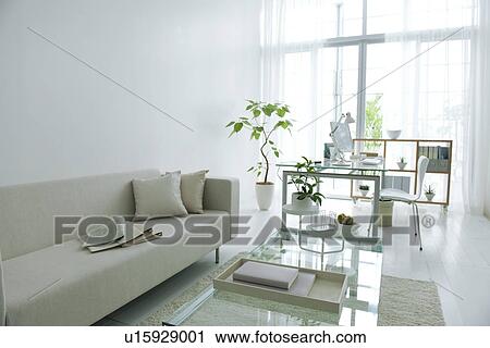 Stock Image - Living room with work desk. Fotosearch