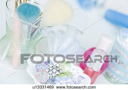 Stock Photo - Make up brushes and perfume. Fotosearch