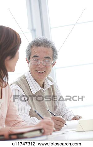 Man and woman studying View Large Photo Image Stock Image - Man and woman studying. Fotosearch