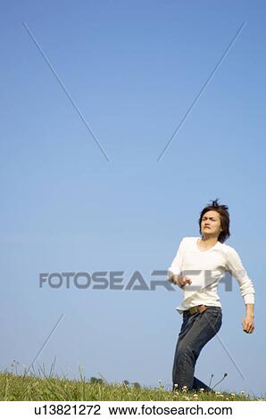 Man running on grass View Large Photo Image Stock Image - Man running on grass. Fotosearch