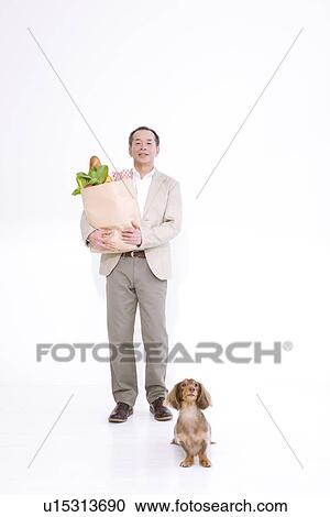 Stock Image - Man shopping for groceries. Fotosearch