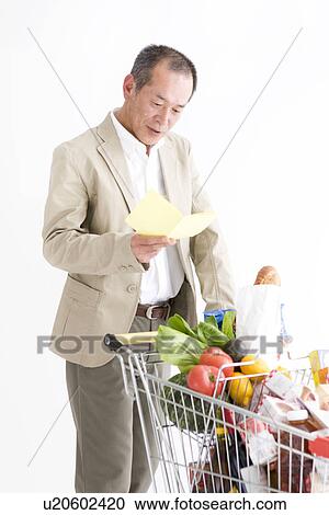 Stock Image - Man shopping for groceries. Fotosearch